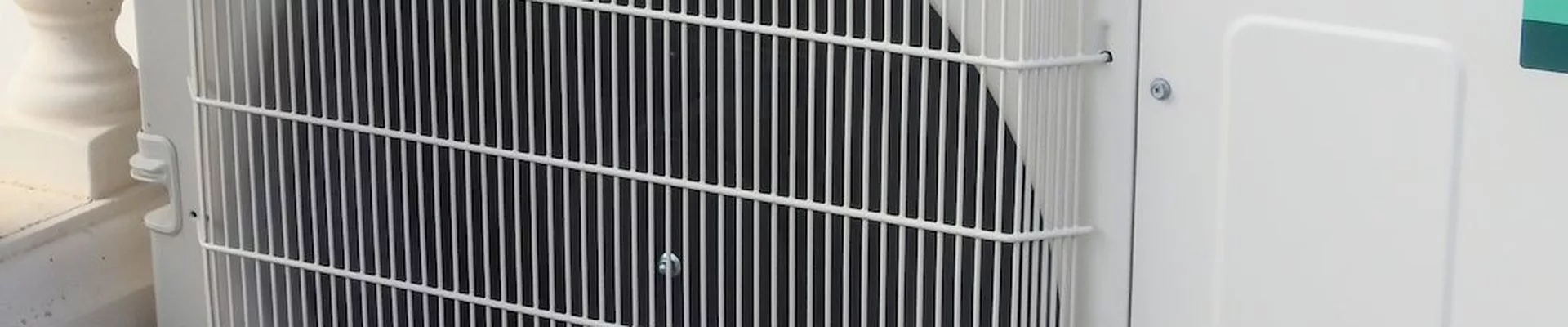 Outdoor unit of a modern air conditioning system on a terrace