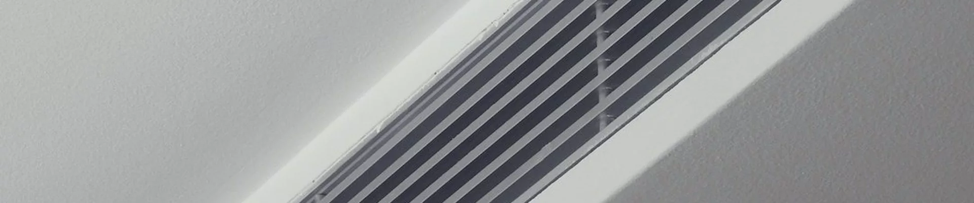Linear air diffuser in a sloped ceiling