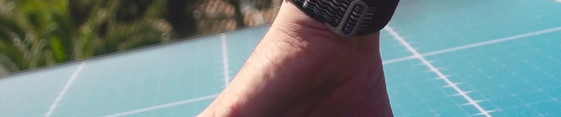 Installer's hand checking the surface of a solar module